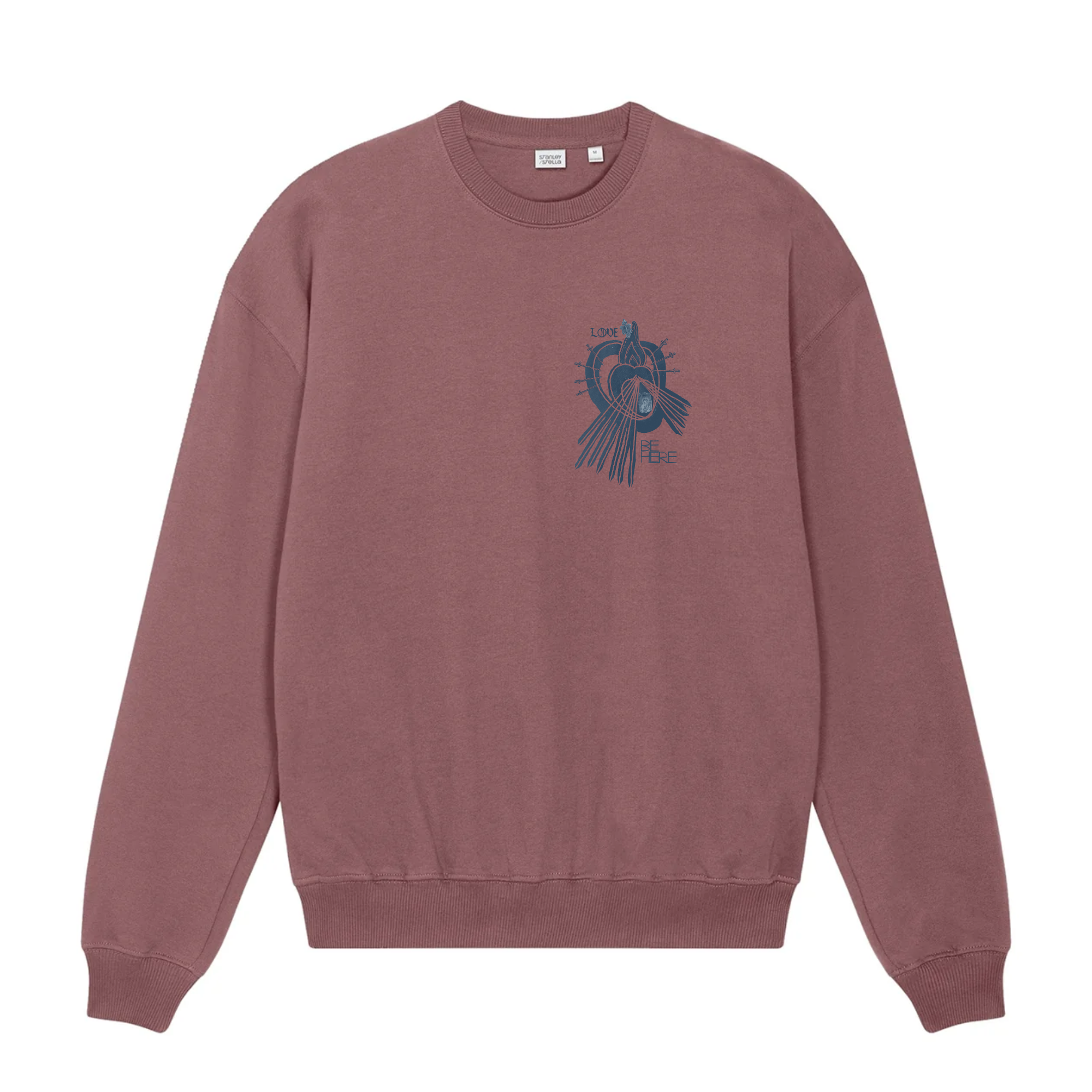 A dusty rose crewneck sweatshirt shown from the front, featuring an indigo blue graphic print of a little human heart enclosed in the womb of the Sacred Divine Mercy Heart of Jesus enclosed in the womb of Immaculate Sorrowful Heart of Mary with the words LOVE and BE HERE