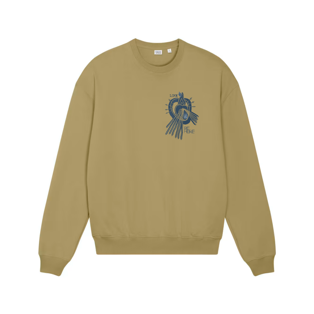 A faded olive green crewneck sweatshirt shown from the front, featuring an indigo blue graphic print of a little human heart enclosed in the womb of the Sacred Divine Mercy Heart of Jesus enclosed in the womb of Immaculate Sorrowful Heart of Mary with the words LOVE and BE HERE