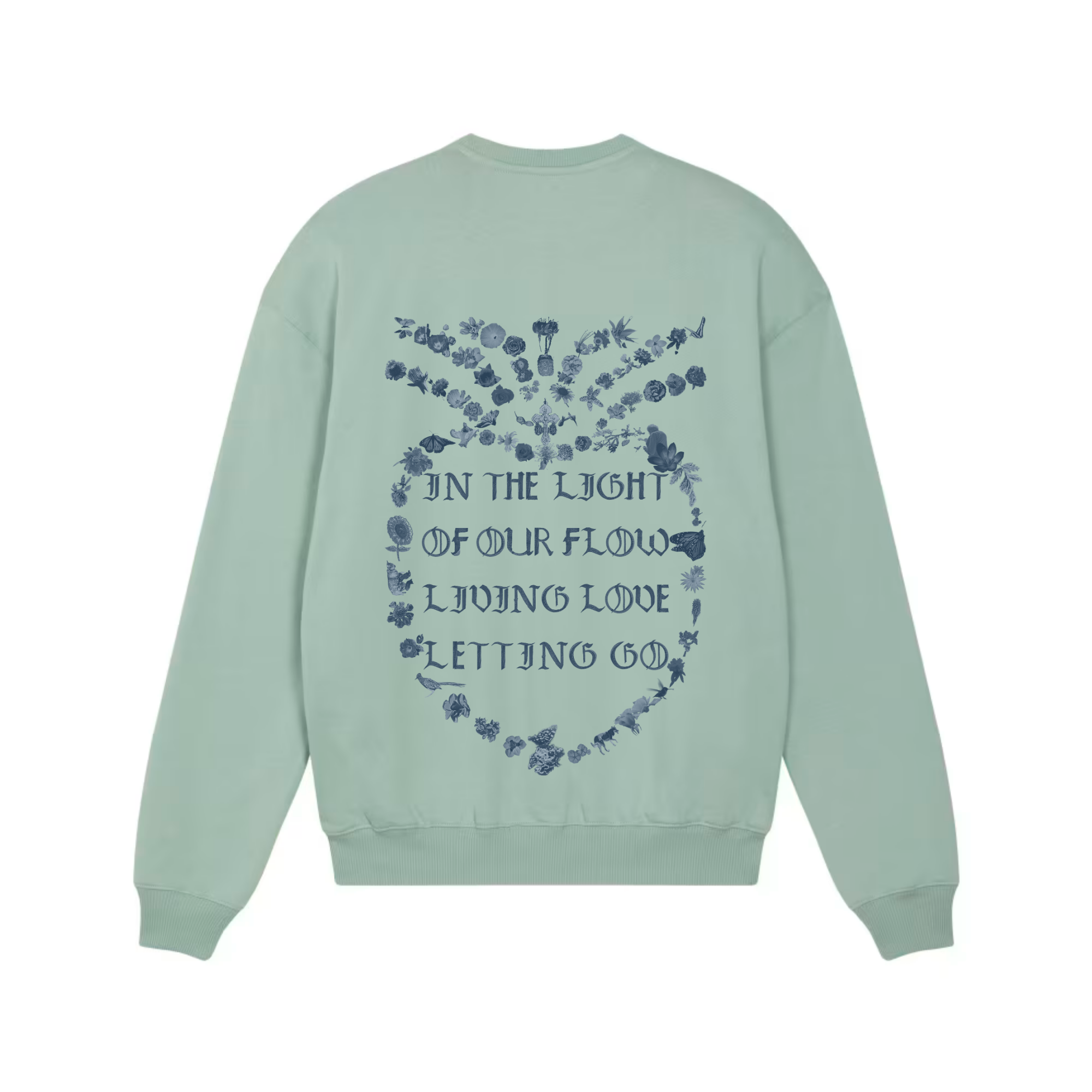 An aloe green crewneck sweatshirt shown from the back, featuring a blue graphic print of a floral heart with the text 'IN THE LIGHT OF OUR FLOW LIVING LOVE LETTING GO'.